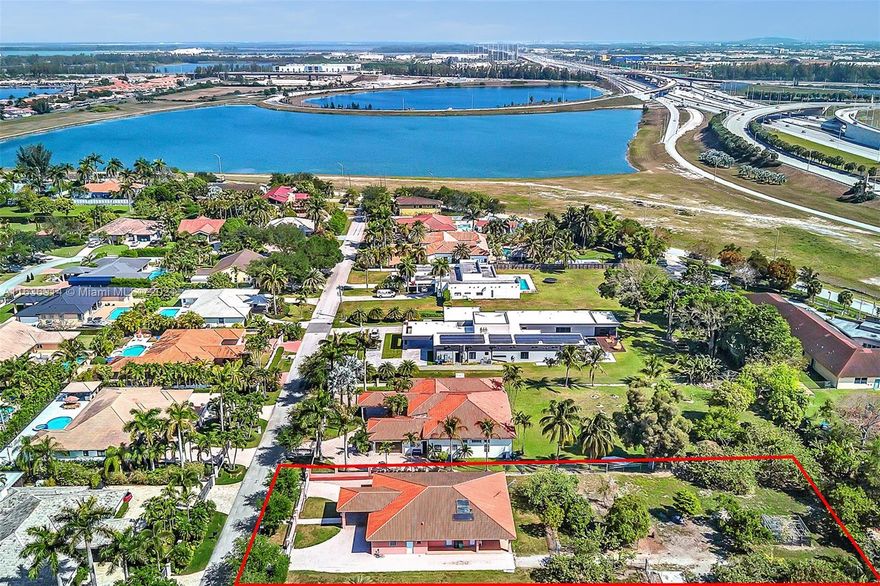 Built-in 2001. This beautiful Mediterranean-style home sits in the heart of Miami and the desired Belen area. This
close to one acre landscaped lot has guava, avocado, orange trees, and plenty of land to plant more and bring all
your toys. The home features a spacious floor plan with five bedrooms, four and a half bathrooms, a formal dining room, and a living room area. The large kitchen and ample family room are open to an expansive terrace. The generous size of this lot and the integrity of this home offer vast opportunities for expansion. This property is off SW 8th Street, with easy access to highways, Miami airport, A+ Schools, FIU, Malls, and shopping plazas. Enjoy this secluded nature retreat within the city—the perfect home to entertain your family and friends. NO HOA