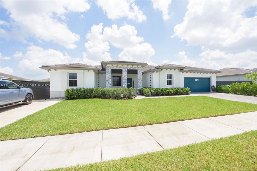 ** MOTIVATED Seller** 5BR/4.5BA Estate featuring sleek tile & laminate floors, impact windows, designer shades, and custom barn doors. Main house is a 2/2.5. In-law suite with private entry, kitchenette, split A/C, open living room and 2 full baths. Or open it up and have  a full 5/4.5 under the same roof! Gourmet kitchen boasts white cabinetry, stainless steel appliances, Corian countertops, island with sink & pantry. Formal dining with chandelier, spacious family room, and covered patio with pavers—perfect for entertaining.  Lavish master with tray ceiling, spa-style bath, dual sinks, glass-enclosed shower, and walk-in closet. 2-car garage, laundry room, fenced yard, LED lighting & more. NO HOA!! PROOF OF FUNDS AND/OR PRE-APPROVAL LETTER REQUIRED PRIOR TO SCHEDULING A SHOWING OF THE PROPERTY!