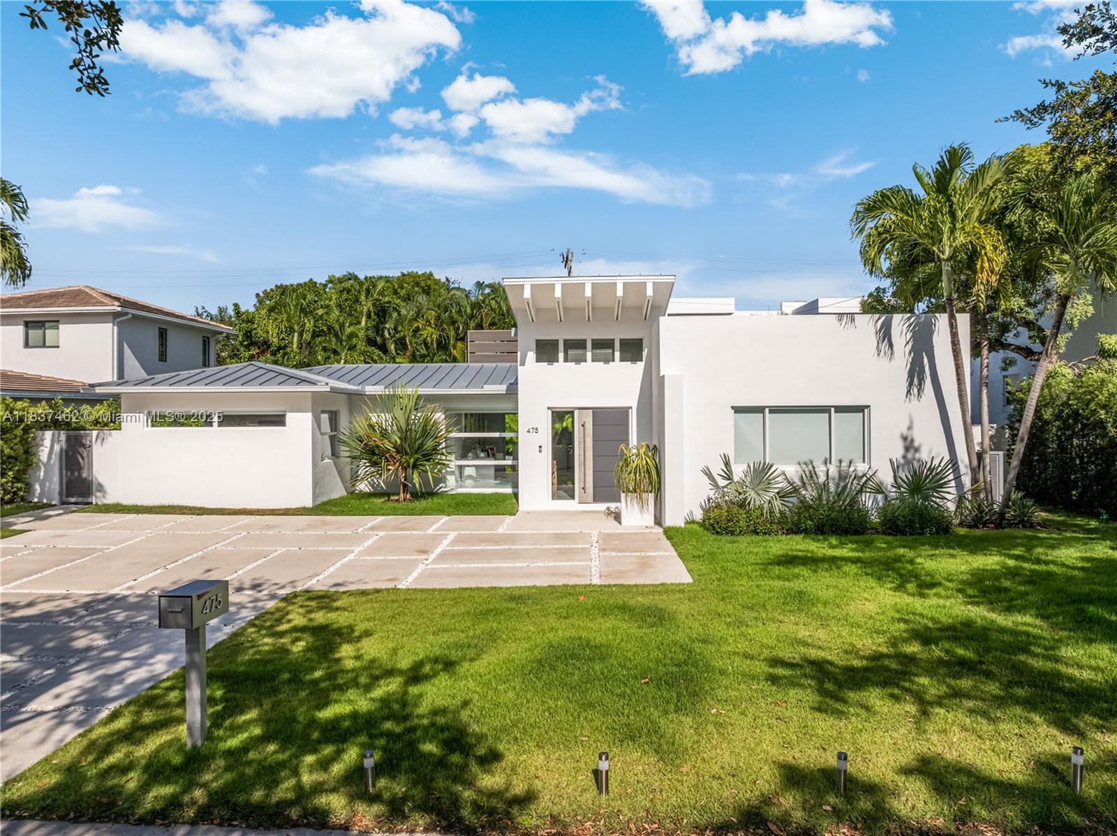 Welcome to your Key Biscayne oasis—where modern sophistication meets tropical elegance. Inspired by the relaxed luxury of St. Barts, this impeccably maintained home features a smart layout with three bedrooms on one side and a versatile fourth room for guests or a home office. Floor-to-ceiling windows fill the space with light, highlighting sleek white quartz floors throughout. The Italian-style kitchen, custom closets, and separate laundry room add everyday ease. Enjoy an integrated audio system, a large modern pool, pergola, and automated lighting and pool systems. With high-end finishes, energy efficiency, and top-tier security, this move-in-ready home offers the ultimate island lifestyle.