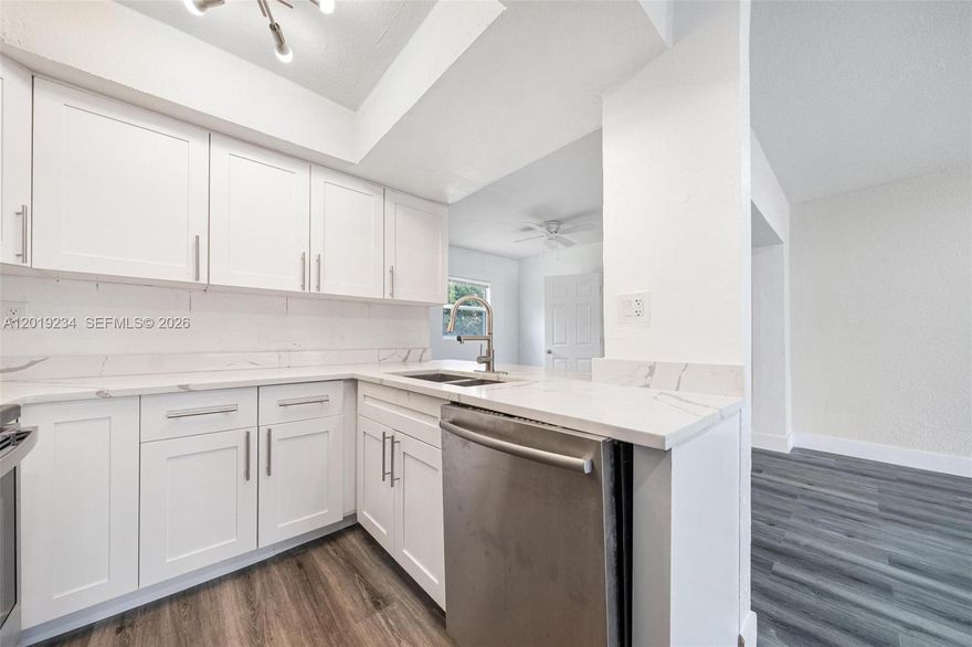 Discover this stunning 3-bedroom, 2-bath home in the heart of Lauderdale Lakes, featuring a beautiful updated kitchen with sleep granite countertops and modern appliances. Non-HOA community, this home offers both comfort and flexibility with no restrictive fee.