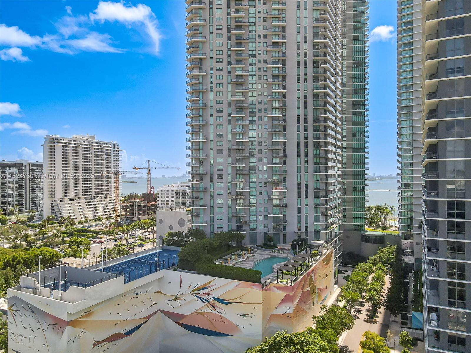 Spacious furnished unit with white tile flooring throughout. The apartment has exceptionally high ceilings (11 feet), which makes it very bright. Closets are big and fully built-out. Lighting fixtures have been brilliantly placed in every room. The building offers the highest level of amenities and 2 pools, one of which is a phenomenal roof-top pool with the most spectacular views of Miami. Walking distance to the stores, movies, restaurants, parks, 20 min from Miami International Airport