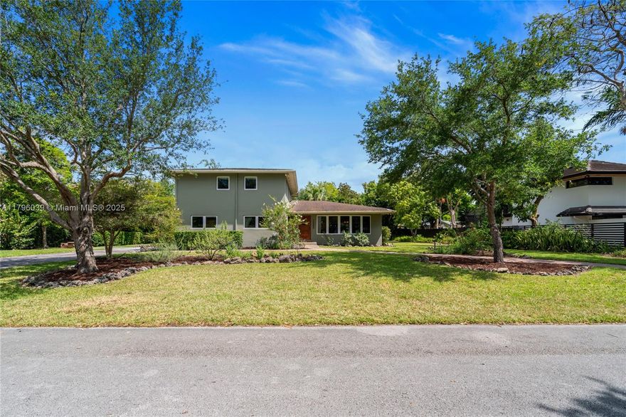 Tucked in the inviting Falls area, this remodeled two-story home shines with appeal on an expansive lot, adorned with stately oaks and colorful crepe myrtles. It features three spacious bedrooms, three refined baths, a den from the partially converted garage, hardwood floors, and a custom kitchen with hardwood cabinets, Santa Cecilia stone counters, and a copper farmhouse sink. Impact windows offer safety and energy efficiency. Bathrooms impress with red oak wainscoting and white tile, blending elegance and warmth. Outside, a screened porch, brick walkways, and a double tiki hut with fire pit create an ideal setting for gatherings. Located in the A-rated Leewood K–8 school district, this home merges classic style with modern upgrades for comfortable, vibrant living.