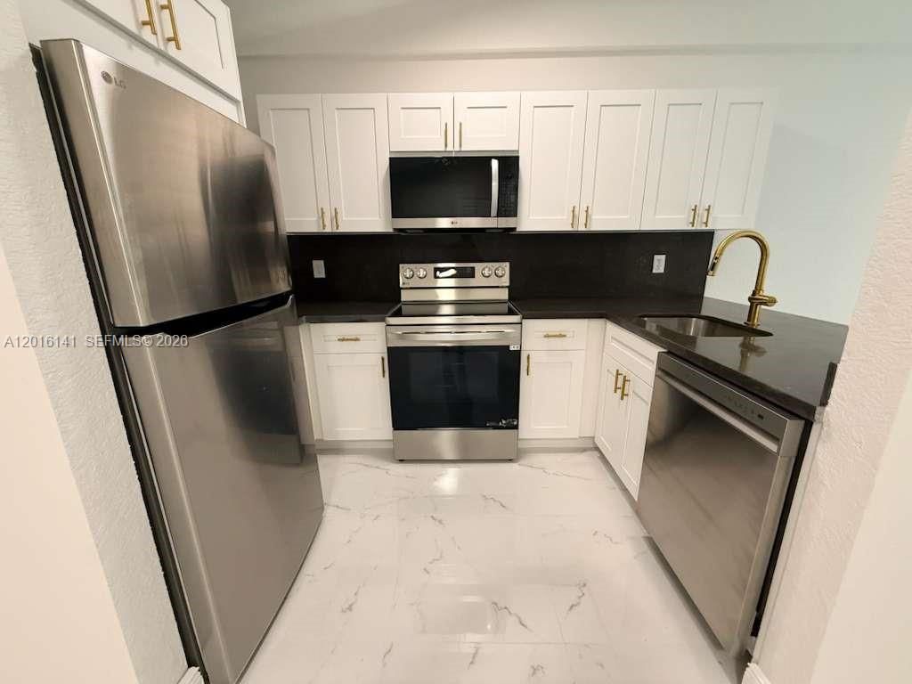 Photo of 1300 Wiley St #2, Hollywood, FL 33019 (MLS # A12016141)