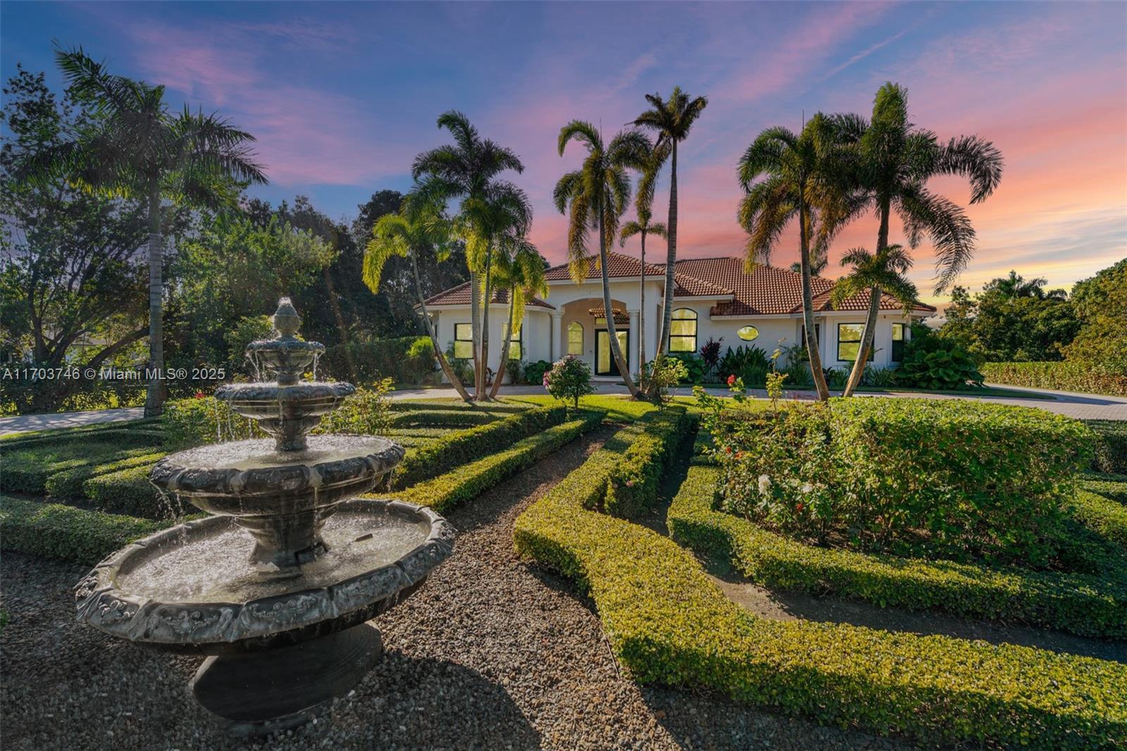 Casa Serena, a breathtaking estate nestled in the heart of Southwest Ranches. This grand 4-bd, 5-ba residence perfectly blends Mediterranean architecture with European contemporary sophistication. Set on an expansive 2.41 acres lot, Casa Serena welcomes you with a french style garden leading to its entrance. Inside, the home has been curated with premium materials and meticulous attention to detail to create a sanctuary of elegance and comfort. The gourmet kitchen, opens to both casual and formal spaces, ensuring effortless hosting. The primary suite, a true retreat, boasts a marble spa-like bathroom, walk-in closet, and a patio with garden and pool views. Outside, lushly landscaped grounds provide the perfect backdrop for alfresco living.