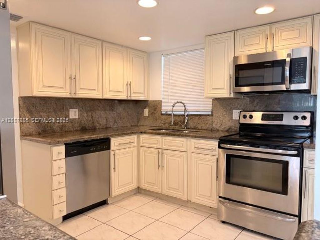 Photo of 3100 Riverside Dr #103, Coral Springs, FL 33065 (MLS # A12007005)