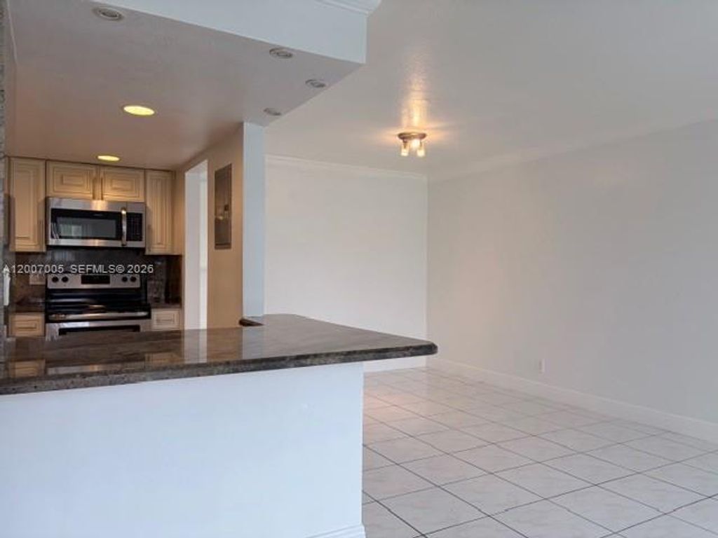 Photo of 3100 Riverside Dr #103, Coral Springs, FL 33065 (MLS # A12007005)