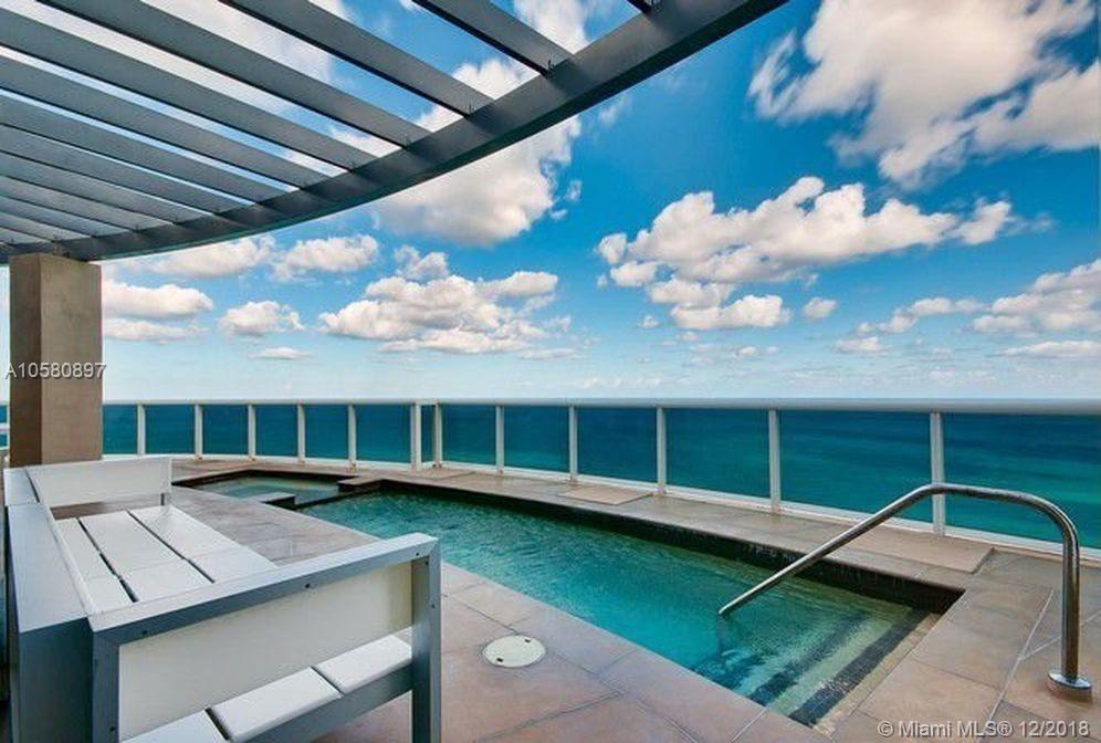 THE MOST SPECTACULAR TURN-KEY 2-STORY PENTHOUSE ON THE BEACH. INCREDIBLE DIRECT OCEAN CORNER WRAP AROUND. ONE OF A KIND RESIDENCE. AMAZING VIEWS ALL AROUND-DIRECT OCEAN VIEWS, INTRACOASTAL & SUNSET VIEWS. YOU HAVE IT ALL! MODERN FINISHES WITH BEAUTIFUL FURNITURE INCLUDED, OVER 21 FT CEILINGS WITH GLASS STAIRCASE AND PRVATE INTERNAL ELEVATOR ! 
APPROX 4,141 SF WITH FOUR BEDOOMS, 2 LIVING ROOMS, DEN, TWO KITCHENS, PLUS A 2,000 SF HUGE WRAPAROUND UPPER LEVEL PATIO THAT HAS A PRIVATE SWIMMNG POOL. RESIDENCE IS FULLY LOADED WITH SOUND, AUDIO, ELECTRIC SHADES & CLIMATE CONTROLS. INCLUDES ALL FURNITURE (EXCEPT ARTWORK). PRIVATE BEACHFRONT CABANA INCLUDED!!!!!.