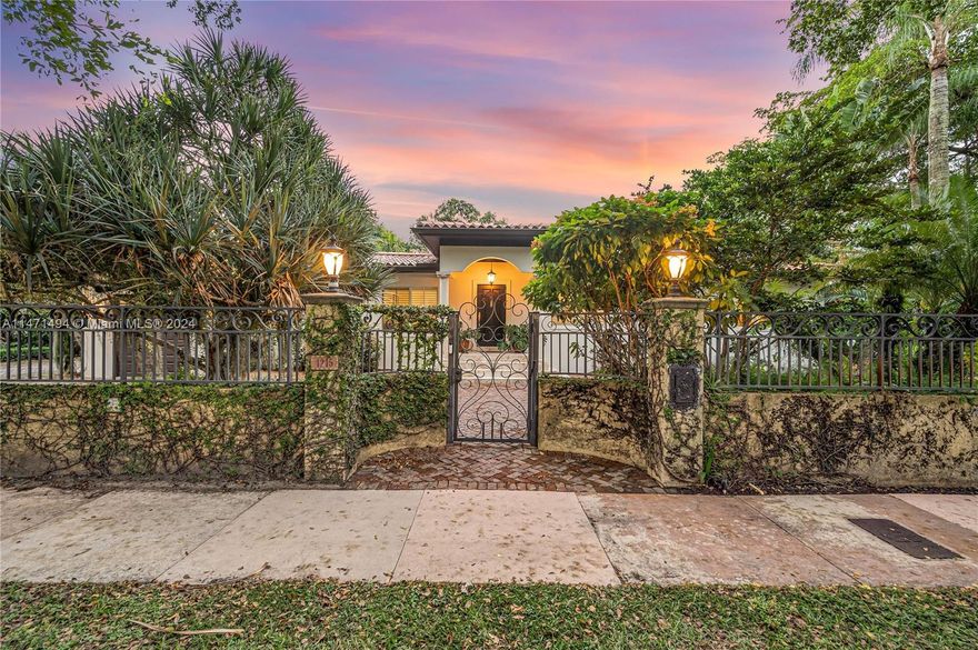 Presenting "Villa Orquídea"- where Tuscan style & sensibility fuse w/ a tropical oasis in one of Coral Gables/ most desirable locales. Situated on a 15,000+ sq. ft. double-lot, this fully walled/gated property features an ample parking court. Interior living quarters w/ freshly polished Carrara marble & wood-flooring. The sleek chef's kitchen & large family room take advantage of the enchanting garden views . Floor-to-ceiling impact glass windows frame the scene. Interior spaces are well-designed for family living. Spacious primary bedroom features an impressive walk-in closet w/ custom cabinetry. Dine al fresco & entertain under the covered patio w/ a full outdoor kitchen.The newly installed pool will delight all who have the pleasure of enjoying "La Vita Bella" in this private paradise.