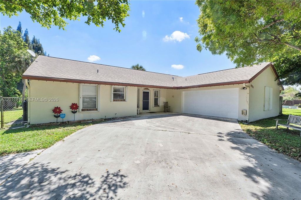 Photo of 694 Dixie Ln, West Palm Beach, FL 33415 (MLS # A12011816)