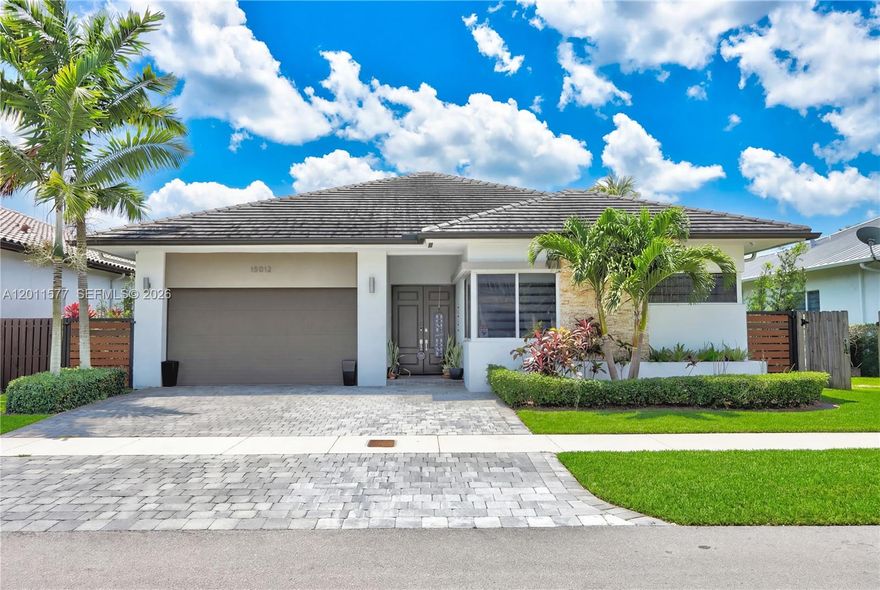 Experience modern elegance in this stunning Island Colonial residence located in the prestigious community of Venetian Parc. This immaculate one-story home stands out with its soaring volume ceilings and a bright, open-concept layout designed for seamless entertaining and abundant natural light. The gourmet-style kitchen flows perfectly into the spacious living areas and a private patio that creates the perfect outdoor retreat. Complete with a dedicated laundry room, a 2-car garage, and premium finishes throughout. Beyond the home, enjoy a resort-style lifestyle with access to the exclusive Venetian Parc Club, featuring a sparkling pool, fitness center, and clubhouse. Perfectly situated with a remarkably low HOA, this move-in ready home is a true gem.