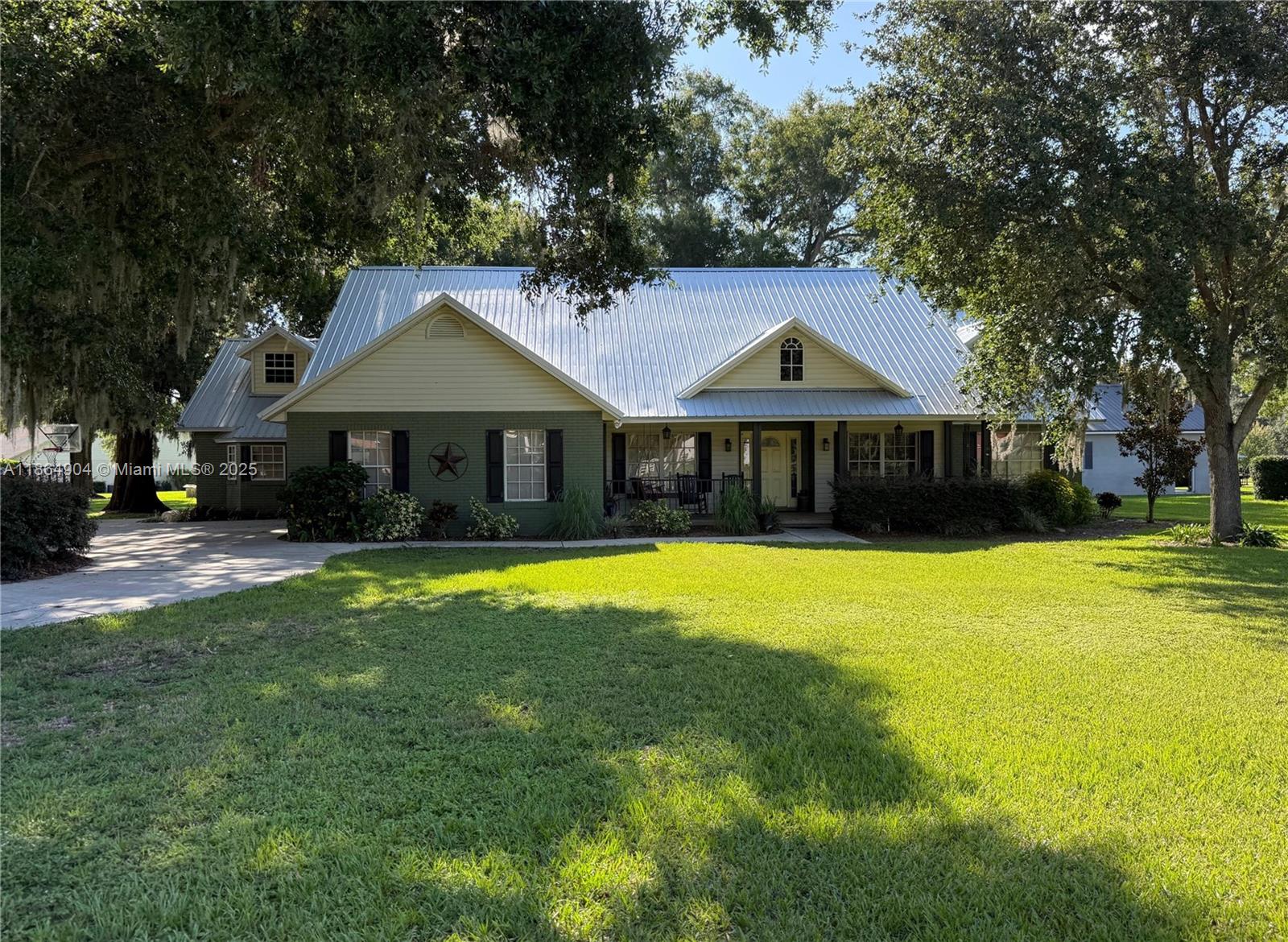 Nestled in a quiet neighborhood near the local high school, this well-maintained 3-bedroom, 2 full bath, 2 half bath block home sits on nearly half an acre (.49 acres) with no HOA! It features a split floor plan with tile, wood, and laminate flooring, granite kitchen counters, a modernized full bath with quartz, and an updated half bath. A spacious loft, currently a bedroom, could be an office or game room. Enjoy the screened back porch and fenced pool built in 2019. The chlorine pool can be converted to saltwater. Also included: detached garage, custom closet storage, attic space, new metal roof, and two A/C units for efficient cooling. Move-in ready with modern upgrades and a great location. Professional photos coming soon.