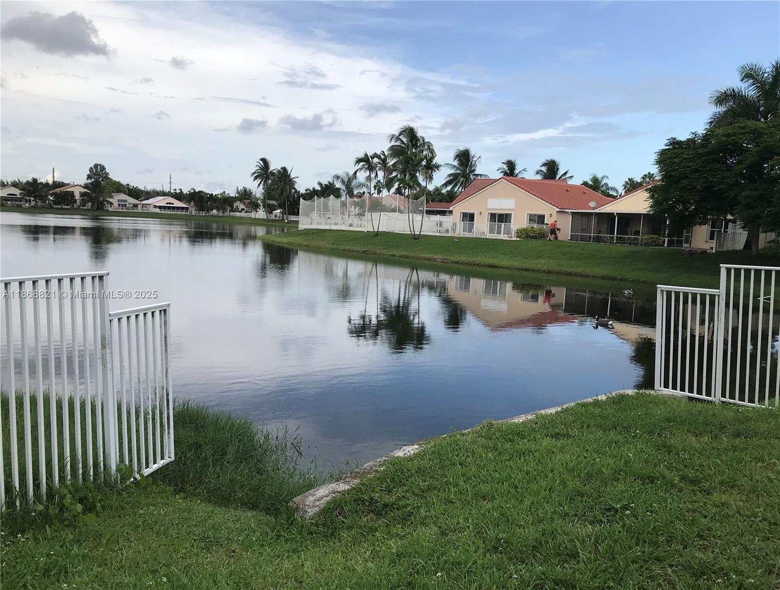 LAKEFRONT GEM!! OPEN & BRIGHT overlooking Lake Volume ceilings boast recessed lighting. NEW A/C, Cabinets & APPLIANCES. Freshly Painted. Oversized yard is newly fenced w/ access to lake. Numerous places of worship are nearby. Enjoy this gated community which offers the RARE ability to store your boat or RV. Will NOT disappoint!