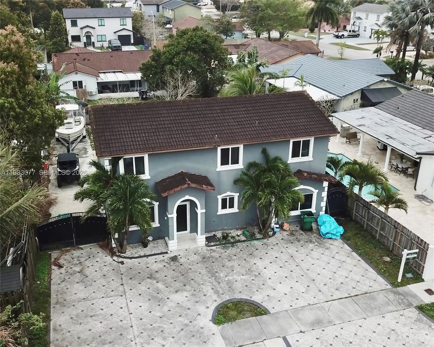 Beautiful 5 bed, 3 bath home in Richmond West offering 2,174 sqft of living space on a 6,873 sqft lot. This well-maintained property features tile flooring throughout, impact windows and doors, stainless steel appliances, and ample parking with gated side access for a boat and RV. The first floor includes one bedroom and full bathroom, ideal for guest, or in-laws quarters for additional income. The outdoor space is perfect for entertaining with a large patio, and located on a quiet cul-de-sac for added privacy and peace of mind. Make this home your own today