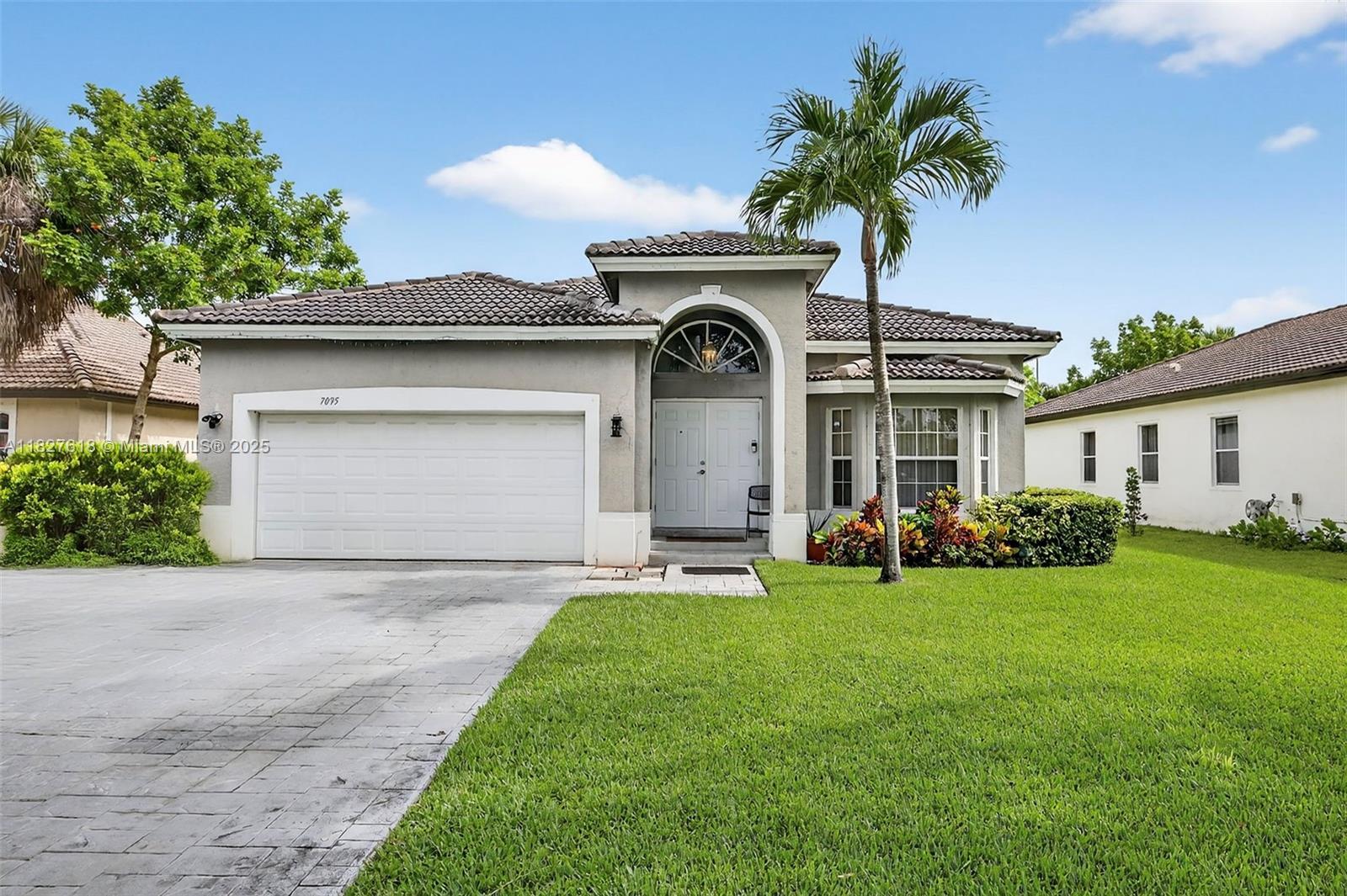 One of only three spacious single-family homes in the highly sought-after Golf Club of Plantation subdivision. This 3-bed, 2-bath home with a 2-car garage sits on a large lot with canal frontage, directly across from the golf course and park. The generous master suite opens to a large backyard with lush, garden-like landscaping, perfect for outdoor entertaining. Features include formal living and dining rooms, plus an open kitchen flowing into the family room. Prime location near major roads and great restaurants.