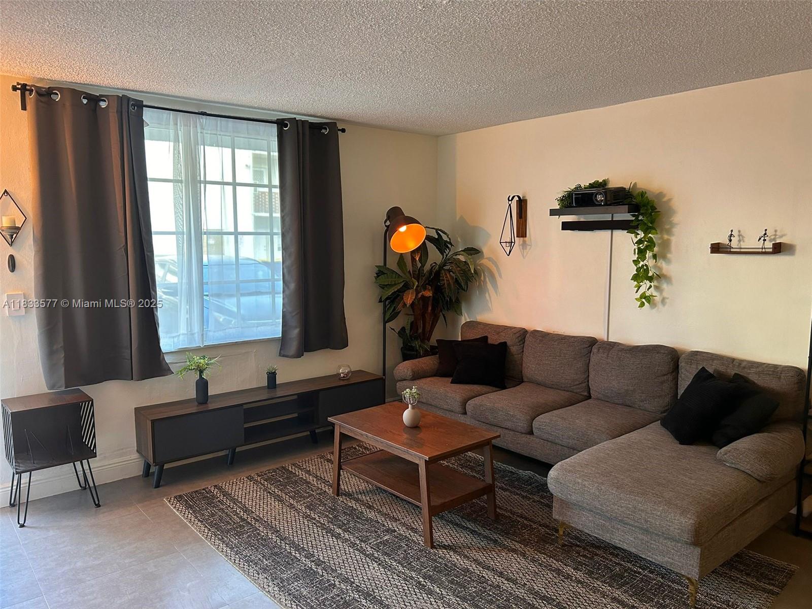 Completely renovated & Furnished first Floor Apartment. Central A/C, hurricane impact windows, open kitchen, green waterfall quarts counter, glass cooktop, backsplash, remodeled bathroom, tile floors throughout, washer/drier in unit. The building is located right across the street from Shuckers Waterfront Bar and Grill. Near the beaches, Normandy park and marinas.