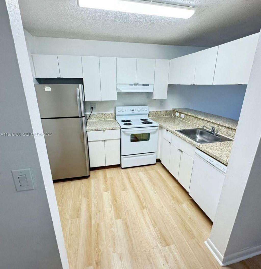 Photo of 9878 Nob Hill Ln #9878, Sunrise, FL 33351 (MLS # A11976758)