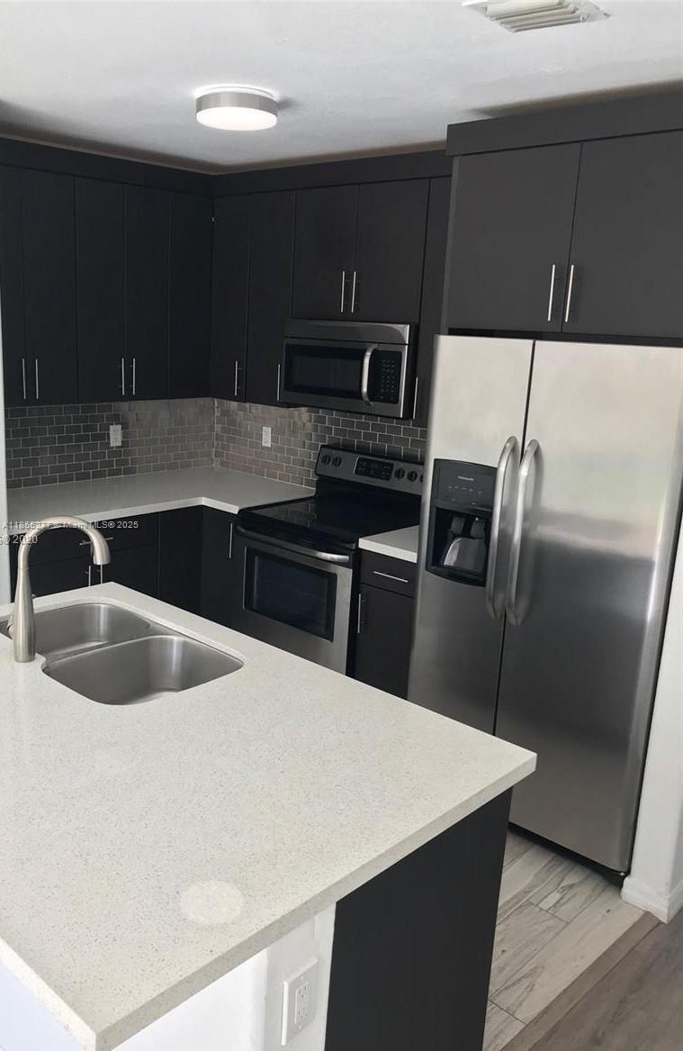 Centrally Located, Remodeled Townhouse!! ready to move in, formal living, Dining and large family room. Private patio with Paver floor. second floor master suite, walking closet. Call or text listing agent for showing