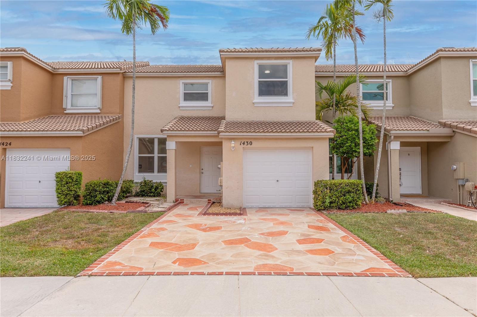 Beautifully updated 3BR/2.5BA townhouse with screened patio. Enjoy peace of mind with a new A/C (2023), refrigerator & microwave (2024), new stove, dishwasher, and a brand new water heater (2025). Hurricane impact windows upstairs & accordion shutters downstairs offer added protection. The entire interior freshly painted in crisp white. Upstairs bathrooms fully remodeled with modern finishes. Upstairs featuring new flooring. Located in a well-maintained community with 3 pools and an elementary school next to the community. Includes one covered attached garage, driveway, and plenty of guest parking. Bright, clean, and move-in ready—offering comfort, style, and convenience! A must-see that's sure to impress!!
