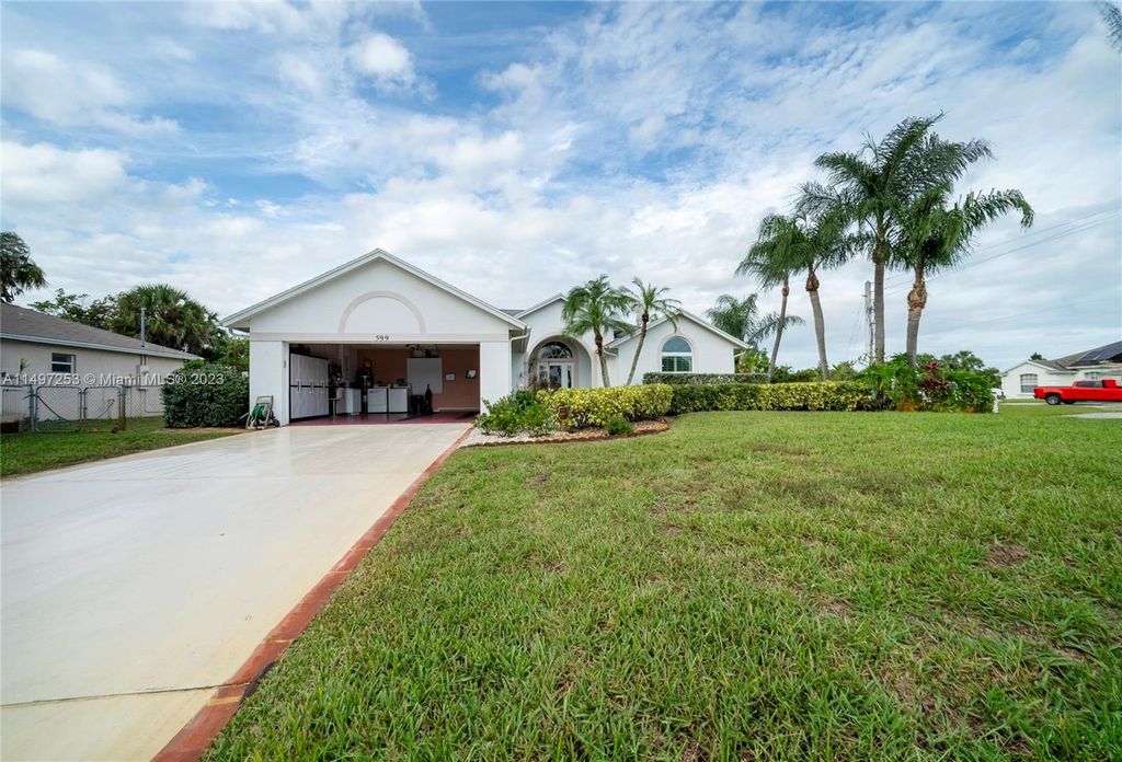 Photo of 599 SE Wallace Ter, Port Saint Lucie, FL 34983 (MLS # A11497253)