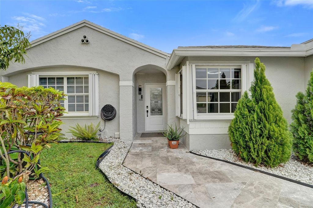 Photo of 11761 NW 12th St, Pembroke Pines, FL 33026 (MLS # A11984558)