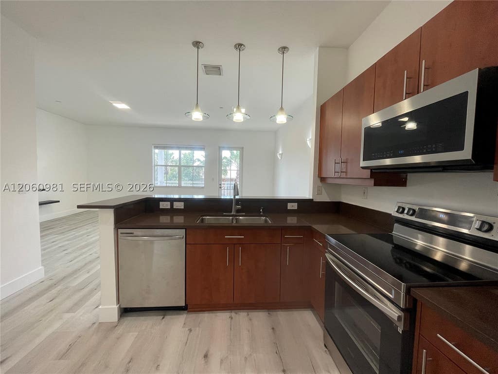 Photo of 412 SW 13th Ter #412, Fort Lauderdale, FL 33312 (MLS # A12060981)