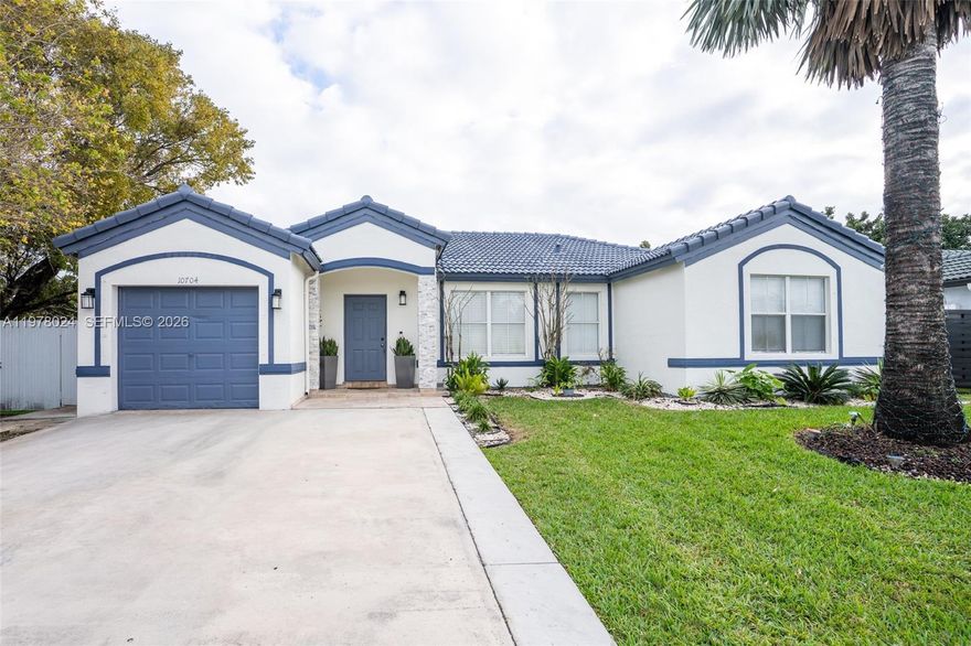 Welcome to this charming, updated, corner lot single-story residence, perfectly designed for modern living. The home features a striking stucco exterior with contrasting blue trim and an inviting tiled roof. The property boosts exceptional curb appeal with a well manicured lawn, trimmed hedges tall enough for privacy, spacious 2 car driveway, a stylish blue front door framed by elegant stone accents and potted plants. 

As you step through the entryway, you are greeted with natural light and an open feel. All throughout the home you will find stunning, high-traffic resistant polished porcelain floors. The dinning room offers a cozy setting for meals and natural light enters through the large placed window. The home offers a spacious living room adjacent to 2 large sliding doors to the patio, great for hosting. 

The beautifully designed renovated kitchen features wood custom cabinetry all throughout, pull-out drawers, added pantry, oven tower, large electric cooktop, sleek quartz countertops, and stainless steel appliances, including a newly bought modern refrigerator. The kitchen also features a dropped ceiling with downlights to lit up all your cooking endeavors.   

The 4 well-appointed bedrooms offers large windows for bright and airy living, architectural wall designs, built-in closets with acrylic sliding doors, and dimmable light fixtures. The master bedroom features elegant recessed lighting and a stylish stepped ceiling, creating a sophisticated ambiance.