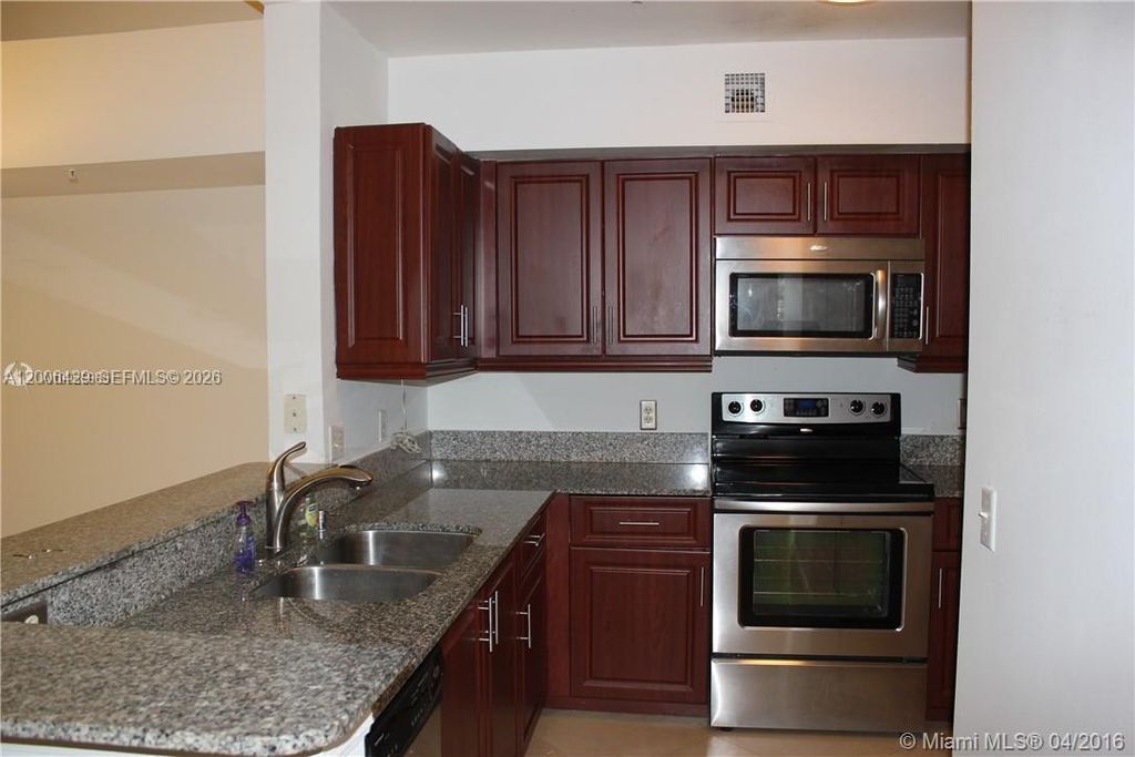 Photo of 2451 Centergate Dr #303, Miramar, FL 33025 (MLS # A12006429)