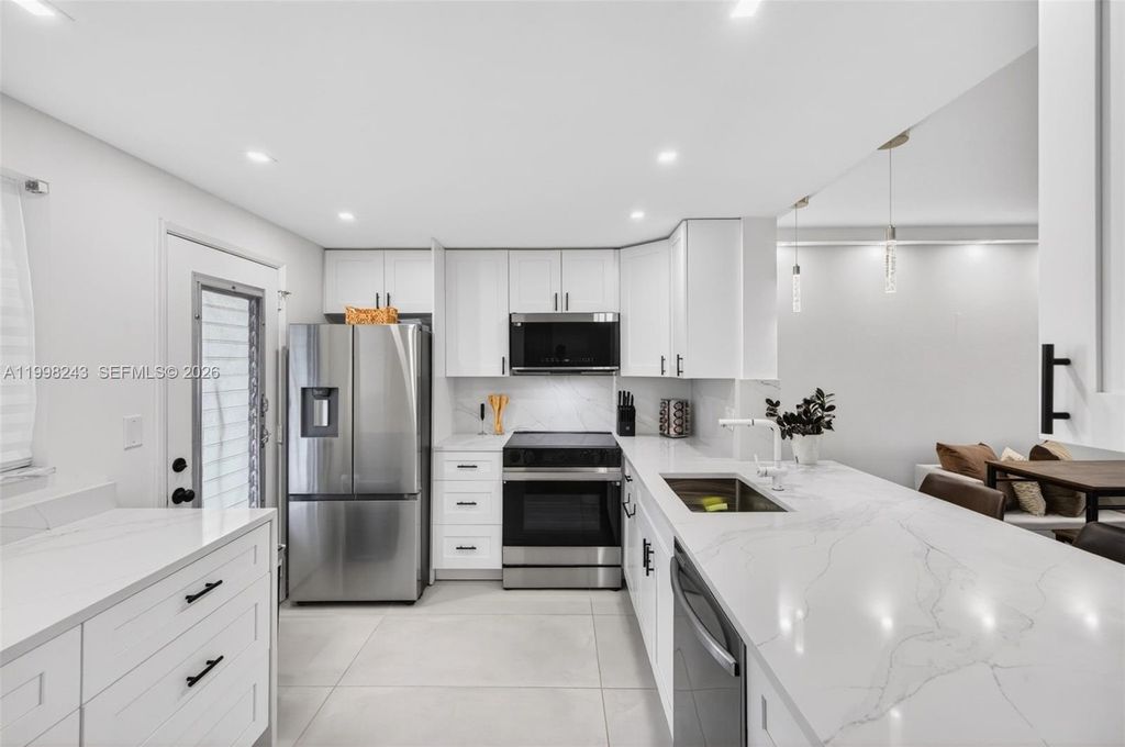 Photo of 420 NE 12th Ave #202, Hallandale Beach, FL 33009 (MLS # A11998243)