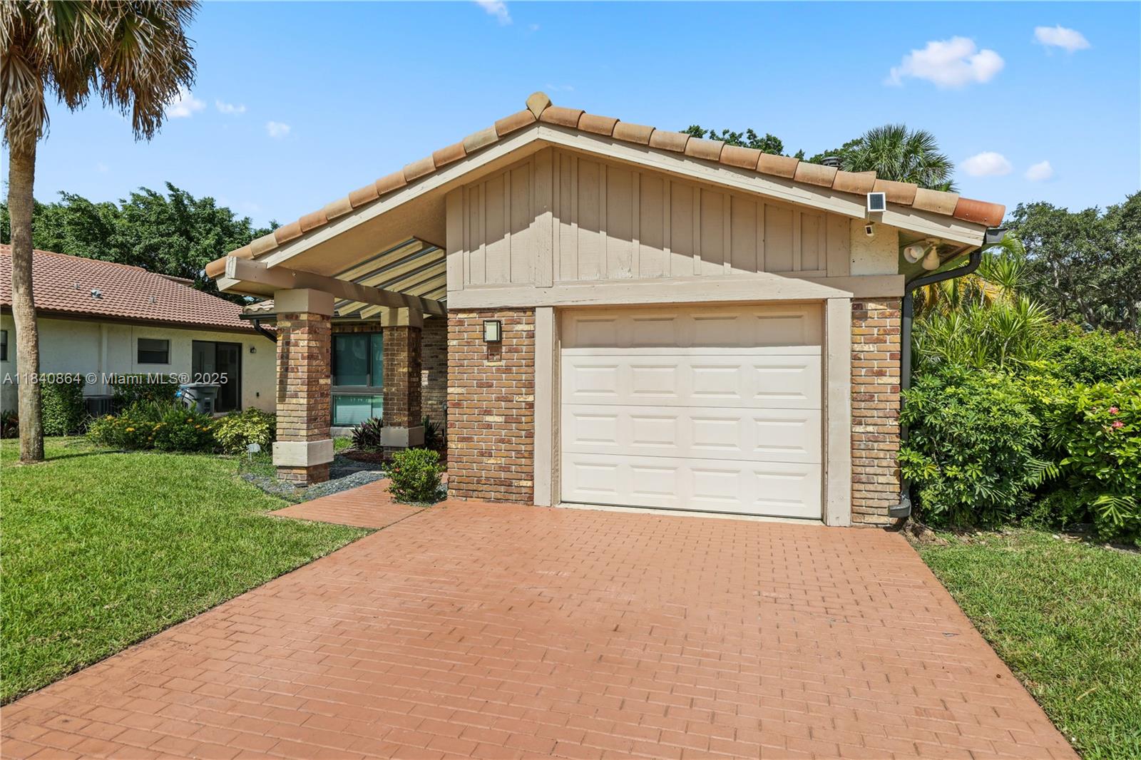 Tucked behind the gates of Boca Greens, this updated 2BD/2BA villa offers low-maintenance living in a highly desirable location. Vaulted ceilings, porcelain tile floors, and a light-filled layout complement the all-white kitchen with quartz counters, stainless steel appliances, and soft-close cabinetry. The enclosed Florida room adds flexible space for an office, den, or guest room with serene views. Upgrades include new AC, impact windows, custom shades, and a custom master closet. Boca Greens is a guard-gated community with walking paths, lakes, and a pay-to-play golf and tennis club—plus nearby parks, dining, shopping, and top-rated schools. The ideal blend of convenience, natural beauty, and active Florida living.