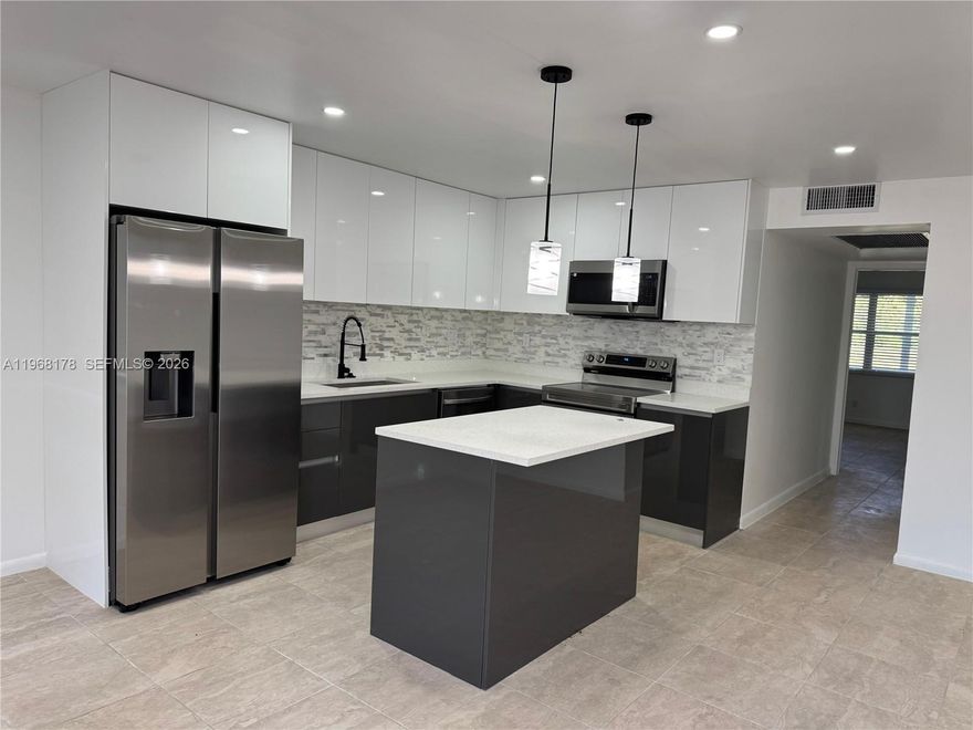 STUNNING fully remodeled 2/2 in a 55+ community! Enjoy serene lake views from this modern, move-in-ready unit featuring high end finishes and a bright, open floor plan. Priced to sell, this one won’t last!