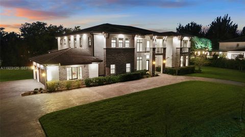 Photo of 17130 Magnolia Estates Dr, Southwest Ranches, FL 33331 (MLS # A11923125)