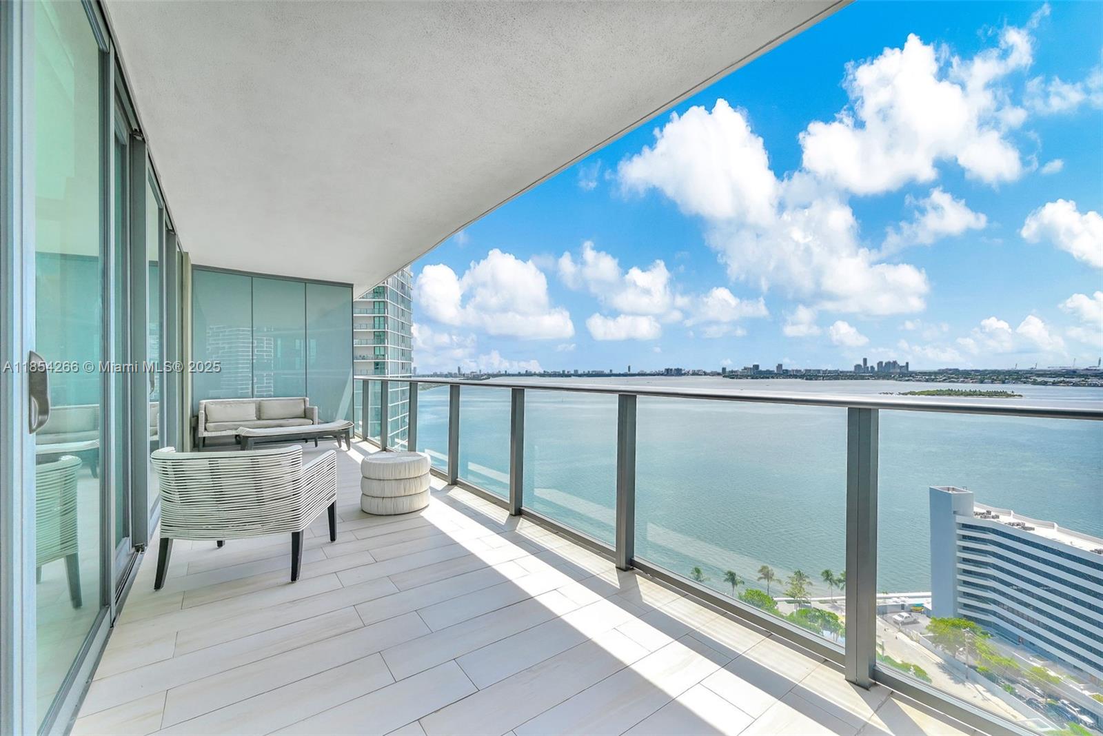 Experience luxury living in this stunning 3-bedroom plus den, 3.5-bathroom corner condo on the 22nd floor of Paraiso Bay in Edgewater. Soaring ceilings and floor-to-ceiling glass windows fill the home with natural light while offering breathtaking, unobstructed water and city views from two balconies. The spacious den, oversized walk-in closets, and fully furnished interiors with marble and tile flooring enhance comfort and functionality. Enjoy top-of-the-line appliances, including Sub-Zero and Bosch, and a spa-inspired primary suite. Paraiso Bay’s world-class amenities feature a theater, billiard room, resort-style pools, fitness center, bowling alley, tennis courts, wine cellar, spa, plus 24-hour security and concierge. Waterfront living at its finest in the heart of Miami!