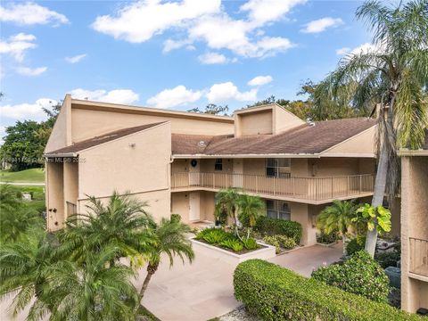 Photo of 7582 NW 86th Ter #103, Tamarac, FL 33321 (MLS # A11911759)