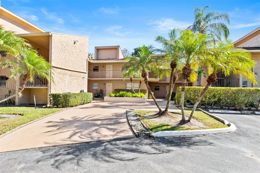 Major Price Improvement!  Welcome to effortless indoor-outdoor living in this beautifully maintained 2-bedroom, 2-bath condo just steps from the lush golf course. The oversized, fully screened wraparound porch creates the ultimate extension of your living space — perfect for morning coffee, evening relaxation, and enjoying peaceful green views year-round. 

Inside, you’ll love the large open-concept living and dining area filled with natural light and designed for comfortable everyday living and easy entertaining. The desirable split floor plan features two private primary suites, each with spacious walk-in closets and ensuite bathrooms. The second suite includes sliding glass doors with direct access to the patio, offering a seamless indoor-outdoor retreat ideal for guests, roommates, or multigenerational living. 

Additional highlights include an in-unit full-size washer and dryer, assigned parking conveniently located just steps from the entrance, and a welcoming all-ages community.

If you’re looking for space, privacy, and a true Florida lifestyle setting, this one checks every box. All ages are welcome community.