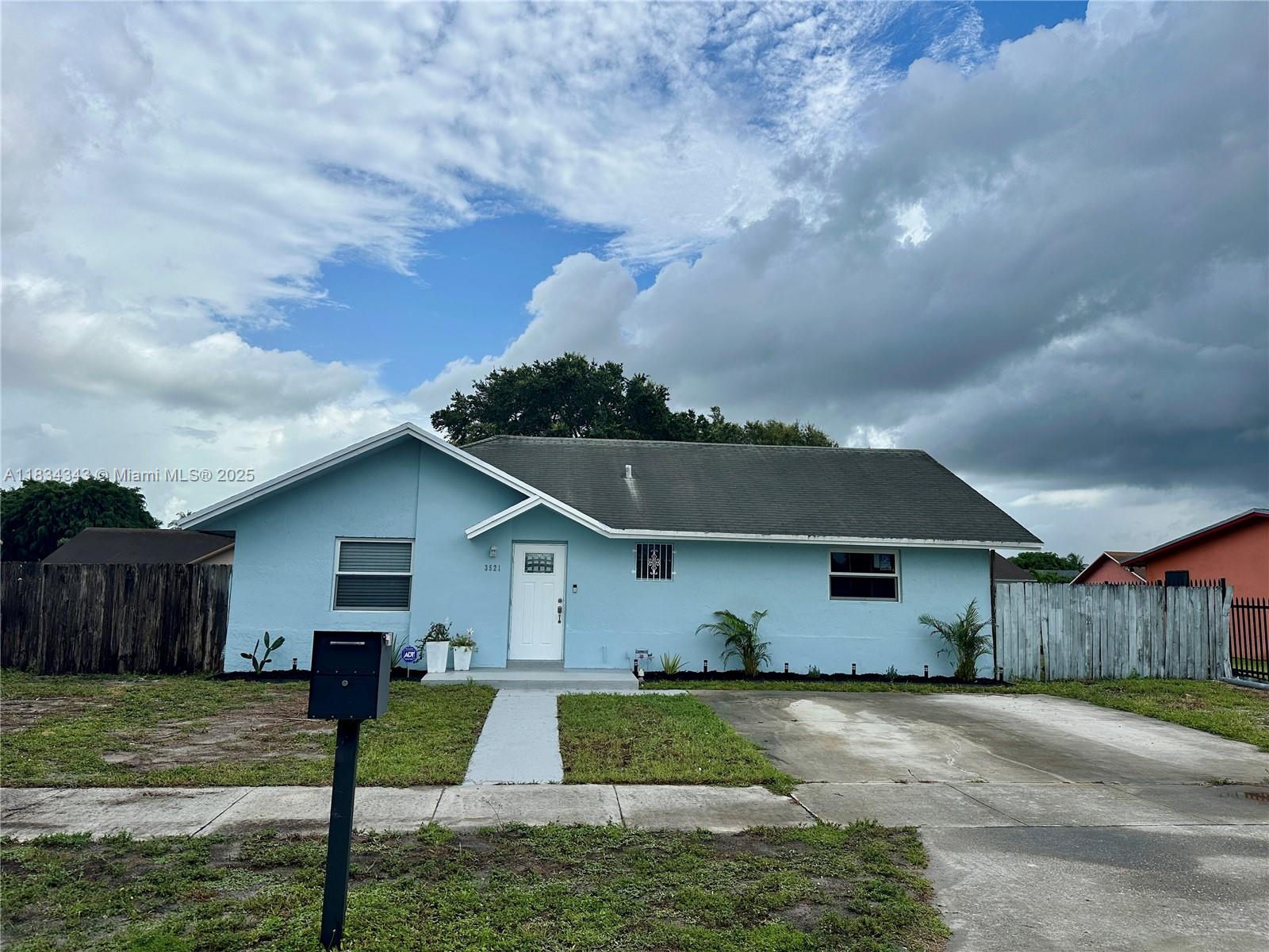 This updated 3-bedroom, 2-bathroom single family home in Miami Gardens features vaulted ceilings and an open-concept layout. It boasts Alaskan white ceramic tile flooring, fresh paint, and new recessed lighting. The kitchen includes modern wooden self-closing cabinets and a dishwasher.
Stay comfortable with a new oversized A/C unit and efficient electric water heater, while most windows are impact-rated for safety. The spacious backyard is great for entertaining, and there's a washer/dryer hookup on the side. This move-in ready home combines modern upgrades with curb appeal in a convenient location. Schedule your private tour today!
