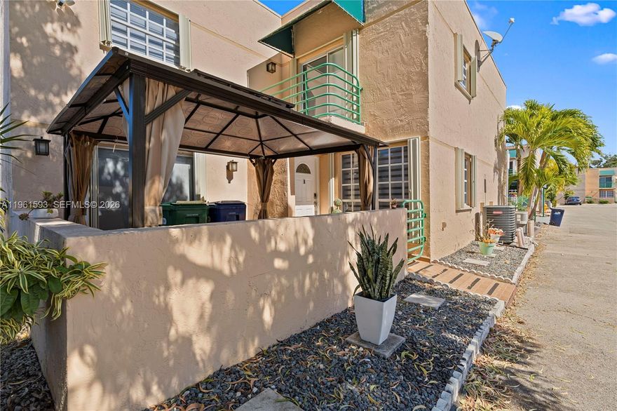 This well-maintained corner townhouse consist of three bedrooms and three bathrooms. The layout includes a bedroom with an en-suite bath on the first floor.  The upstairs area consists of the master bedroom with a bathroom inside, and a separate bedroom and bathroom.  A warm and welcoming atmosphere is created by the kitchen's efficient design and its openness to the  living area. The unit comes with two assigned parking spaces and accordion shutters throughout.     A great choice for first-time buyers.  The entire community will have a new roofs and the exterior will be painted on all units.   The community is a very desirable close to shopping center, supermarket and theater.  Call listing agent for showing at any reasonable time.