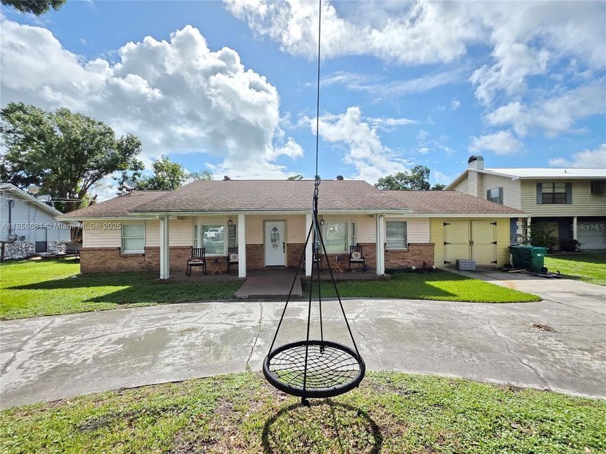 LAKE OKEECHOBEE ACCESS - Goes to Intercoastal - 3/2 spacious home with open concept, updated kitchen with island, stunning fireplace in family room, patio and dock to enjoy the water.