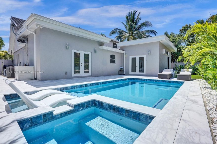 Beautifully remodeled 4-bedroom, 2.5-bath home features a den/office and a separate bonus room within over 2,500 sqft under air. Located on a corner lot with a spacious paver driveway providing ample parking. The master suite includes a private office/sitting room, walk-in closets with built-ins, and a luxurious bath with a separate shower, tub, and dual sinks. French doors open to a newly designed resort-style backyard with marble tiled flooring, artificial turf, and an outdoor shower, plus a Pergola sitting area perfect for entertaining. The modern kitchen boasts an open concept, a formal dining room with a custom butler’s station, a wet bar, and updated flooring throughout home. The home also features two newer AC units (2023) and recessed lighting. Located just 2 miles from the​​‌​​​​‌​‌​​​‌‌​​​‌‌‌​​‌​​‌‌​​​​ beach.