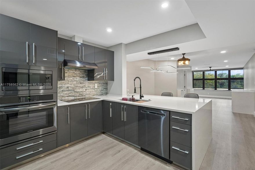 Experience the perfect blend of modern living and natural surroundings in this beautifully upgraded 2-bed, 2-bath + den home. Featuring impact windows and automated blinds, this residence offers both safety and convenience. The gourmet kitchen boasts granite countertops and stainless steel appliances, while the waterproof luxury vinyl floors provide a sleek, low-maintenance look. Enjoy breathtaking views of the nature preserve, bringing tranquility to your daily life. Added highlights include a newer A/C, a tankless water heater, and access to resort-style amenities such as a theater, Olympic-sized pool, two-story gym, tennis courts, and more. Prime location – just minutes from major highways, top restaurants, and entertainment! SELLER MOTIVATED!  Association requires min 15% down.