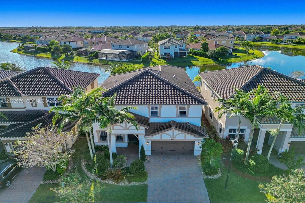Photo of 8610 Lakeside Bnd, Parkland, FL 33076 (MLS # A12012979)