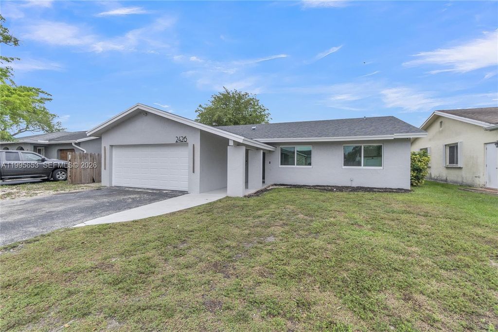 Photo of 2426 NW 108th Ter, Sunrise, FL 33322 (MLS # A11995653)