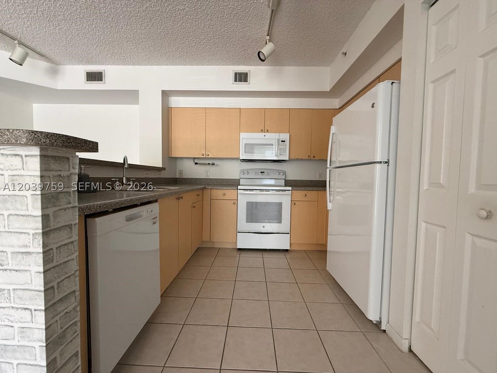 Photo of 8050 N Nob Hill Rd #105, Tamarac, FL 33321 (MLS # A12039759)