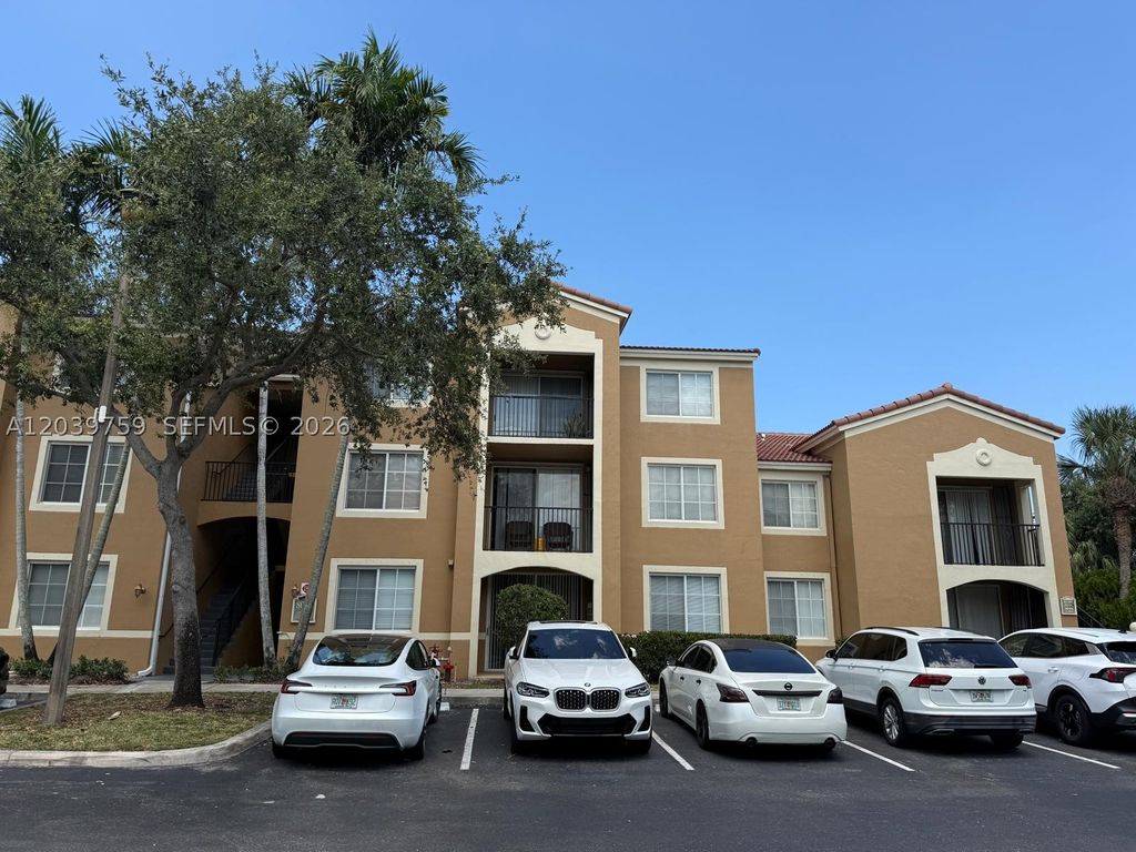 Photo of 8050 N Nob Hill Rd #105, Tamarac, FL 33321 (MLS # A12039759)