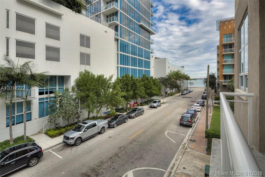 Rarely available loft style corner unit with private bedrooms and partial water views. Features polished concrete floors, upgraded kitchen with granite counter tops, stainless steal appliances, and ample cabinet space for storage; 12 foot high loft style ceilings with exposed duct-work; fresh paint and brand new modern baseboards. Walk to Margaret Pace Park, Publix, restaurants, shops, and bars. 10% down payment available, 30-year fixed, 4.25% interest rate, 4.75% APR, as of Jan 15, 2016. Don't miss!