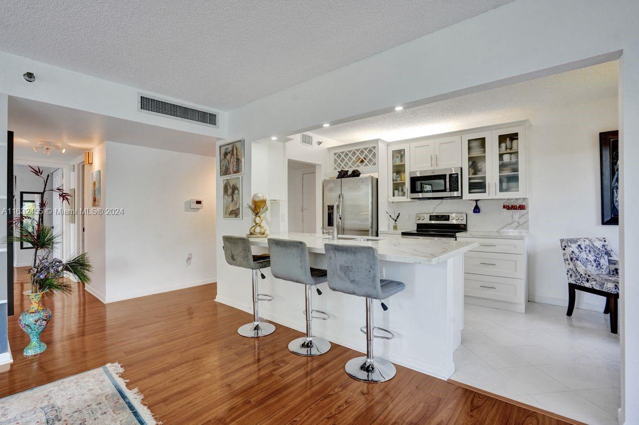 Beautiful bright , light and meticulous 3rd-floor corner unit. This stunning unit boasts 2 bd, 2 ba and a very spacious open floor plan. The kitchen features beautiful Corian counters and s/s appl. Step out onto the extra-large balcony and take in the serene waterview of the lake. New storm shutters. LG washer/dryer. New Smart Fridge. Bosch AC. Expansive master suite boasting walk-in closets with built-ins. The shower floors are artist designed epoxy in both bathrooms.
Discover 55+ community of Hillcrest, ideally situated in the heart of Hollywood. Experience luxury and convenience with amenities including 24/7 security, a heated pool/hot tub. Close proximity Hospital, VA, shopping, dining, beaches, Casino, Ft. Lauderdale Airport, and the iconic Hollywood Boardwalk. No Leasing!