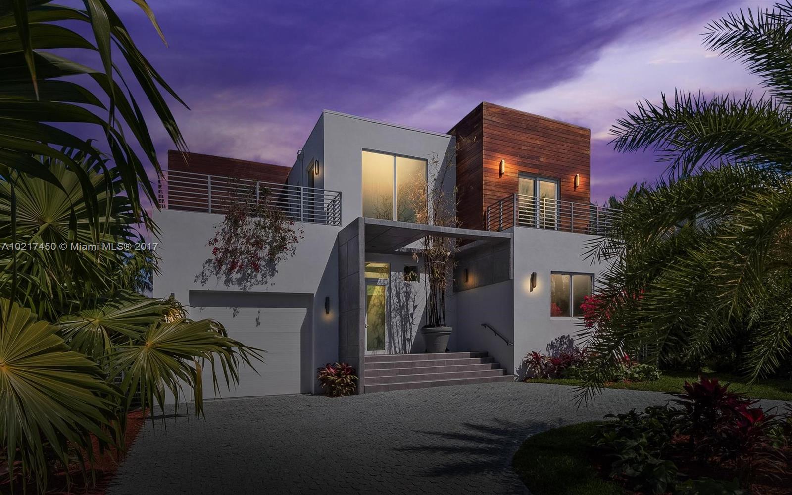 CASA MIA. A SHOW STOPPER! NEW Lush Landscaping completes her. Gallery wall space & soaring ceilings for your Masterpieces or Little Artist’s creations. 5 BR- 3 up & 2 down. Office, guest rooms or family bedrooms can be "home" to a single person or an entire family. Double ceiling height garage for multiple autos & circular driveway leaves plenty of guest parking. Infinity pool, outdoor kitchen, & 2 outdoor sunrise & sunset decks add to the unique aspects of this home & the Sunset IV Miami Beach lifestyle.