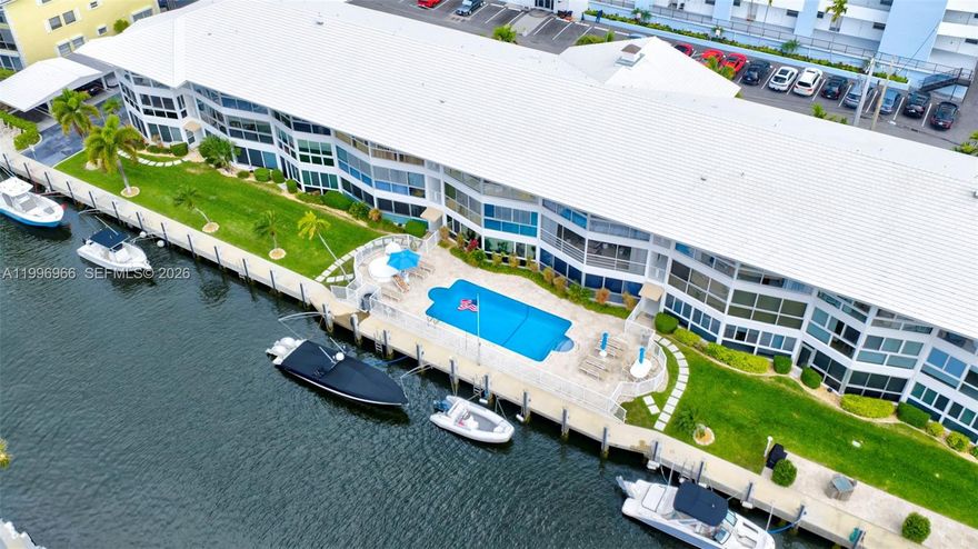 NO PENDING ASSSESSMENTS! 1648 LIVING SQ FT. SIRS COMPLETED! HEALTHY RESERVES! SELF MANAGED! HURRICANE IMPACT WINDOWS & DOORS. NEW SEAWALL. DOCK AVAILABLE FOR RENT – Only $150/Month (up to 38 ft boat). NO Fixed Bridges. Completely upgraded intracoastal-front 2-bedroom, 2-bath condo with an assigned covered carport, located just minutes from Lauderdale by the Sea vibrant nightlife, beaches, restaurants, and top entertainment destinations. This boutique 30-unit, self-managed community offers community pool, BBQ area, library, social room, extra storage, and Concrete restoration completed providing peace of mind for buyers. Property highlights include: open floor plan, corner unit with lots of windows providing an abundant of natural lighting creating a bright and airy atmosphere, enclosed lanai, contemporary faux wood accent panels and over $145,000 in upgrades including a fully updated kitchen and bathrooms, modern flooring throughout, custom closets, built-in surround sound system, smart stainless steel appliances, and a freshly painted interior. This is a rare opportunity to own a beautifully upgraded waterfront condo with boating access in a prime location.