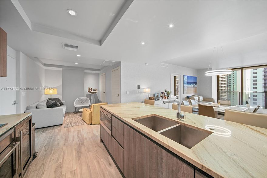 Enter through a private foyer into this stunningly design forward 2-bedroom plus den residence with a spacious balcony showcasing breathtaking city views. Features include an open kitchen with top-tier appliances, a large pantry/laundry area, a built-in master closet, and roller blinds and custom wallpaper finishes in the bedrooms. SLS LUX offers world-class amenities, including a spa, gym, sundeck pool with bar, rooftop pool, wine and cigar lounge, kids' room, and social lounge. Ideally located just steps from Brickell City Centre, enjoy the best of Brickell’s vibrant lifestyle within walking distance.