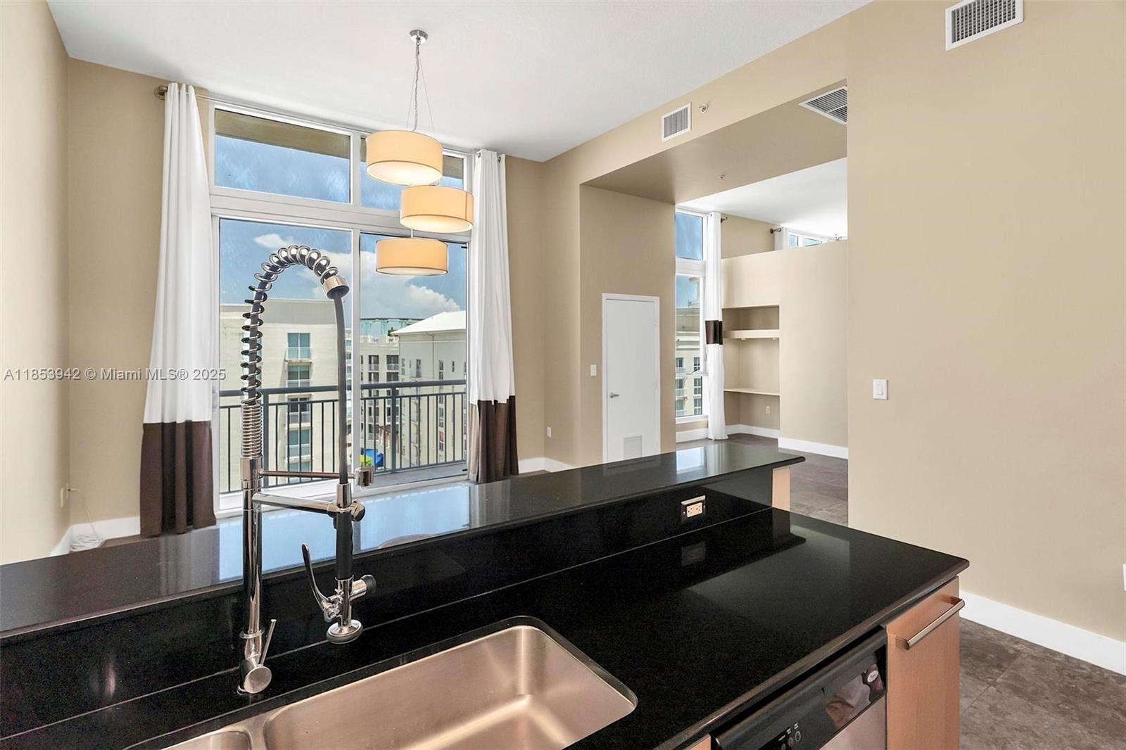 Unique loft style corner unit featuring 2 beds 1 bath, soaring 13' ceilings, beige kitchen cabinets with stainless steel appliances, new energy efficient Bosch AC unit, 2 in 1 washer/dryer. Abundant light with floor to ceiling windows. Ample closets and storage throughout this beautifully tiled unit. Building offers: 2 heated pools, jacuzzi, 2 gyms, clubroom, saunas, 24 hour concierge, 24 hour valet and 24 hour security patrol. FOB secured building. Walk to Dadeland Metro Station South, Publix, Trader Joes, Dadeland Mall and all up and coming Restaurants.