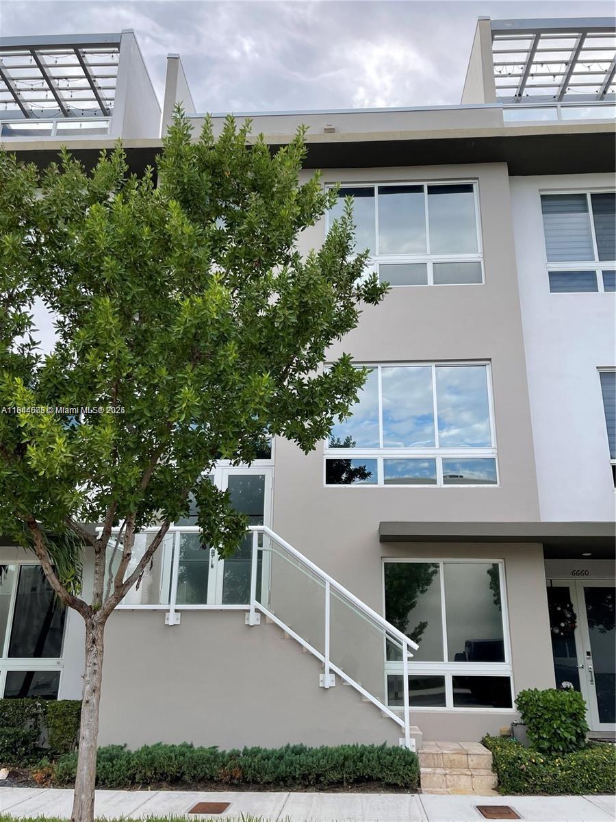 Discover modern living in the heart of Doral with this stunning four-story residence built in 2018, featuring 4 bedrooms, 3 full bathrooms, and 2,683 sq. ft. of elegant living space. Designed with comfort and sophistication in mind, the home offers spacious bedrooms ideal for families or a home office, a gourmet kitchen with stainless steel appliances and quartz countertops, a water softener system for premium water quality, and a Tesla EV charger for added convenience. Located near top-rated schools, shops, restaurants, and entertainment, this property also grants access to exclusive community amenities including a pool, gym, and recreational areas—making it the perfect place to call home.